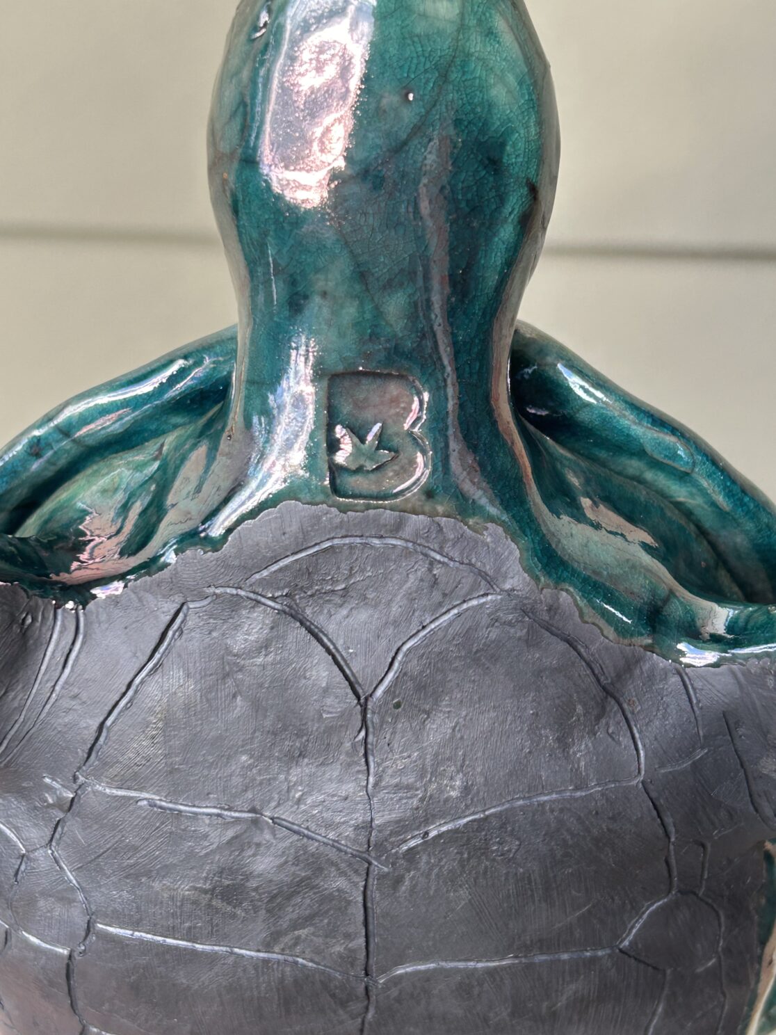 raku fired stoneware sea turtle close-up